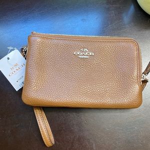 Brown leather coach wristlet